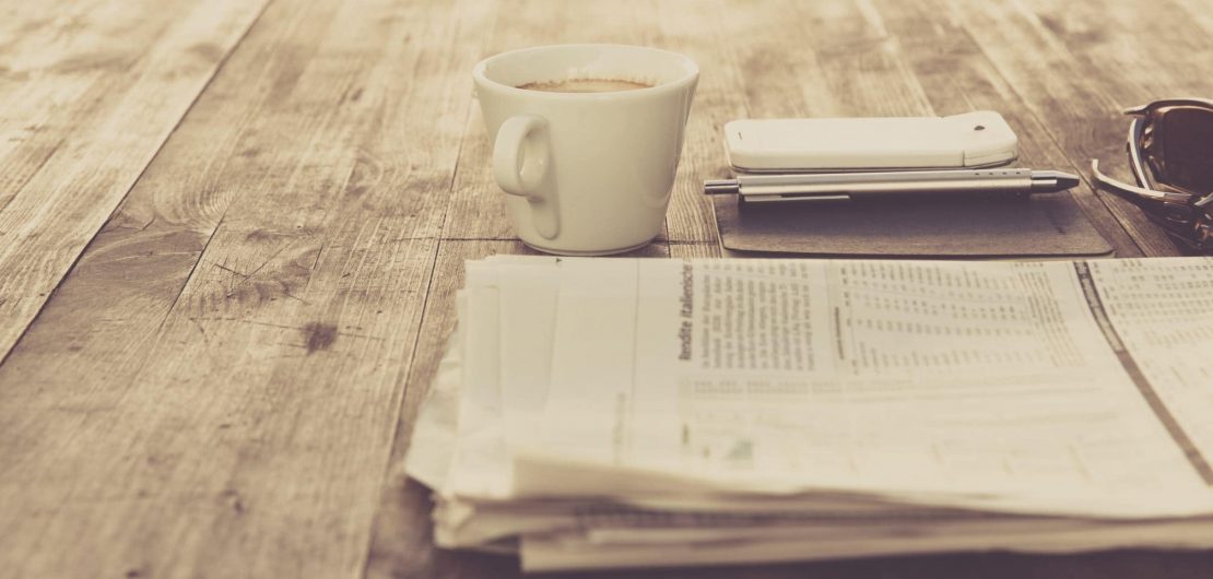 Newspaper and coffee